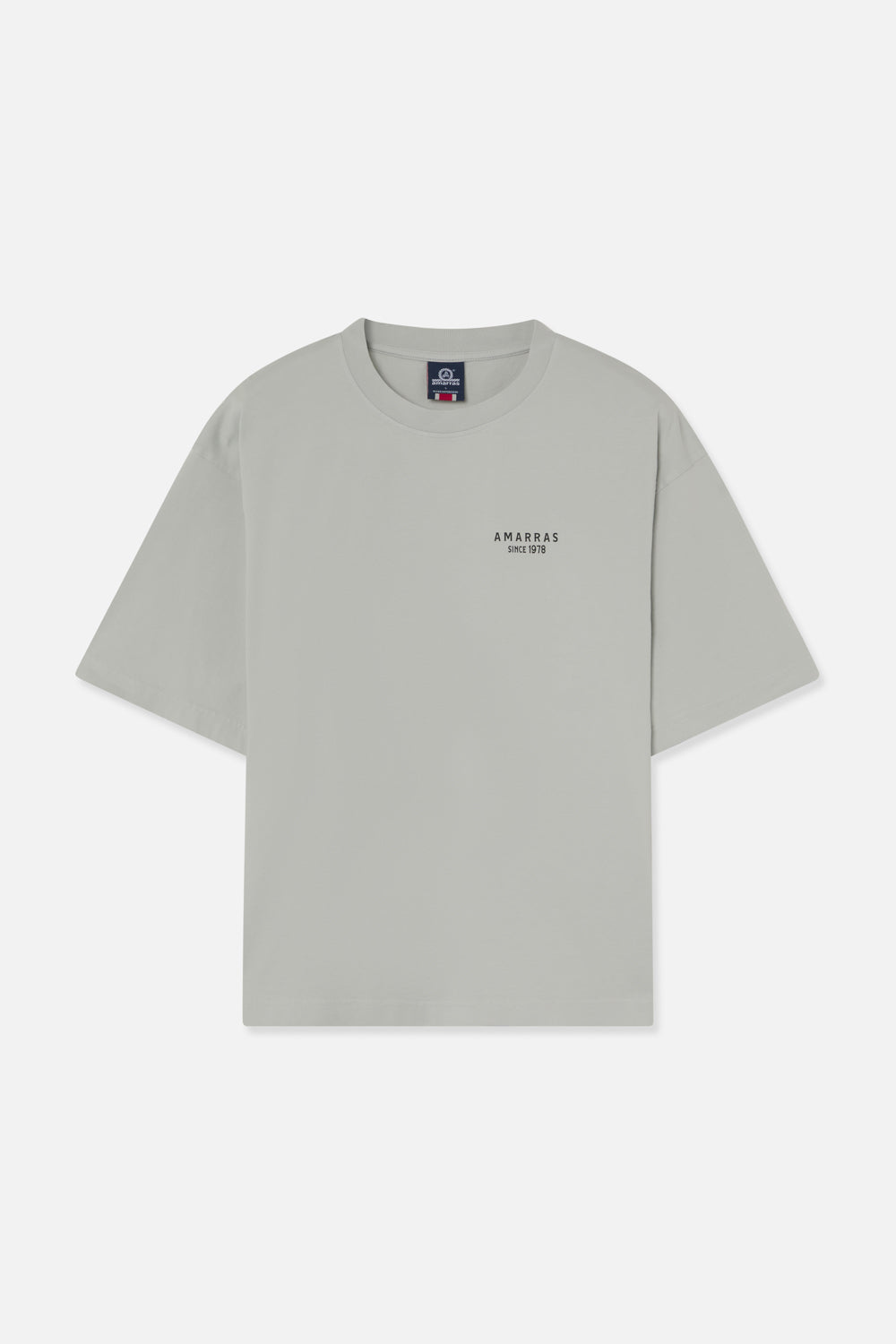 Camiseta Amarras Statenunisex corte boxy fit color gris con logotipo minimalista en el pecho.