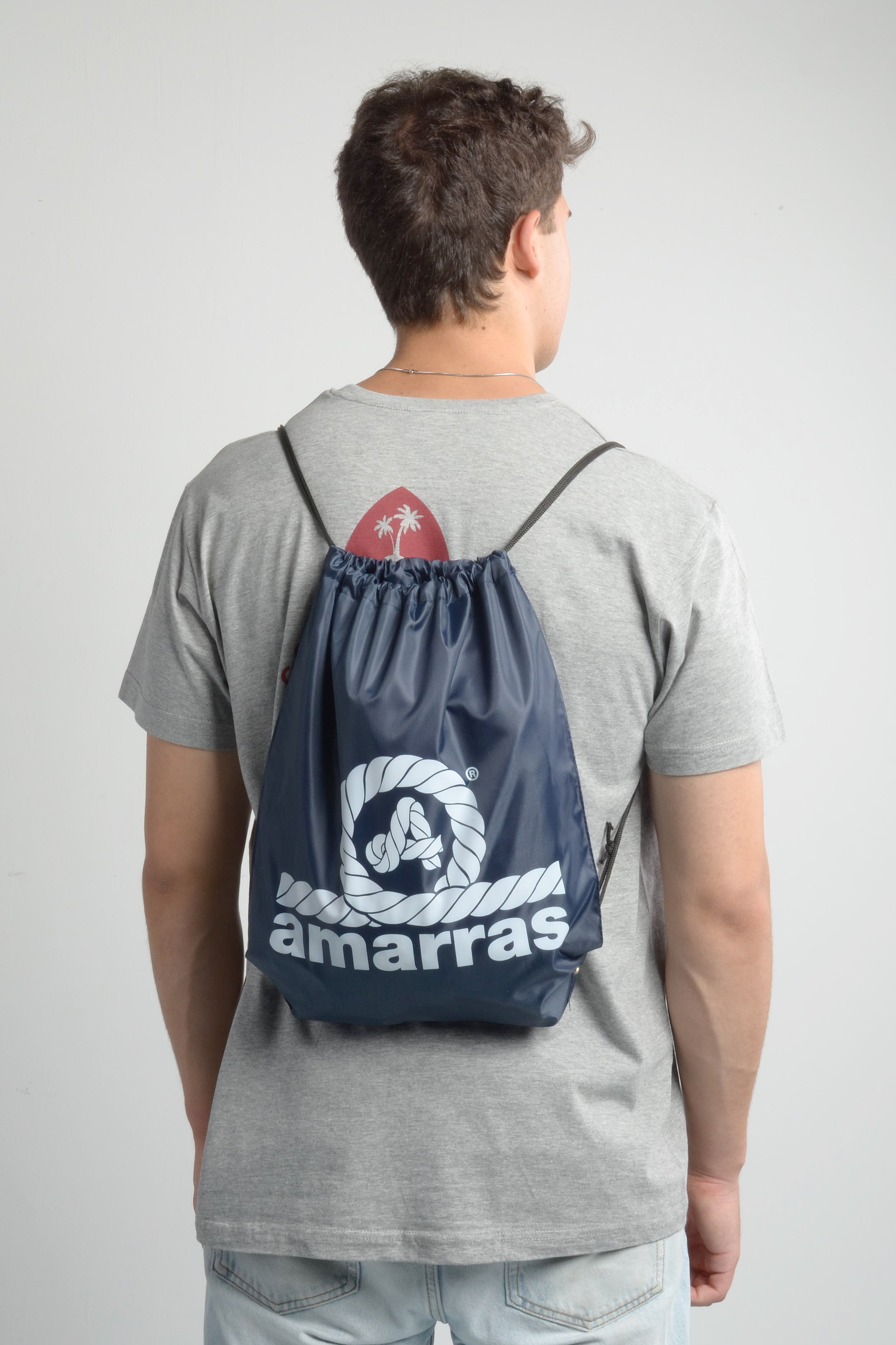 mochila saco amarras en color azul marino con logotipo en color blanco